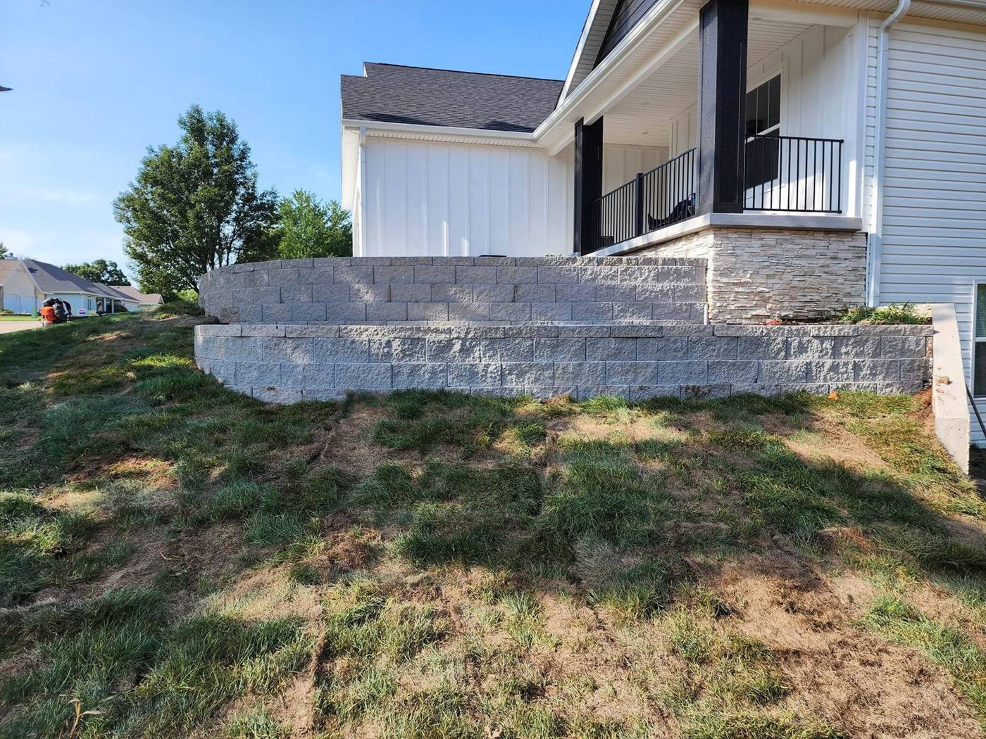 Close view of stone retaining wall and porch